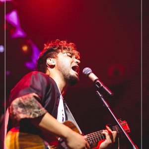 Sushant KC performing on Stage with guitar