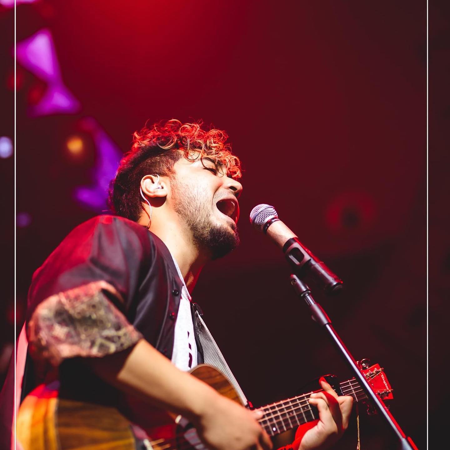 Sushant KC performing on Stage with guitar